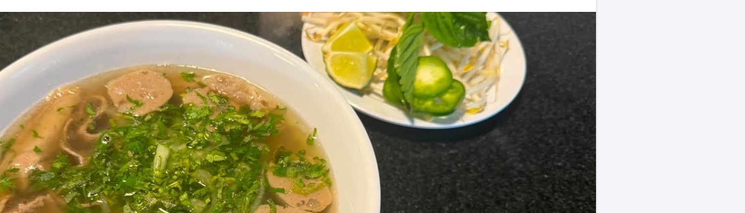 Combo pho with herbs, lime, jalapeno and bean sprouts