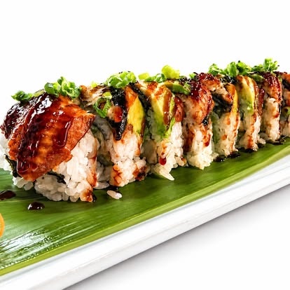 A glazed specialty sushi roll prepared by KAKI Restaurant